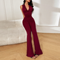 Elegant jumpsuit med spets, V-ringning och utsvängda ben